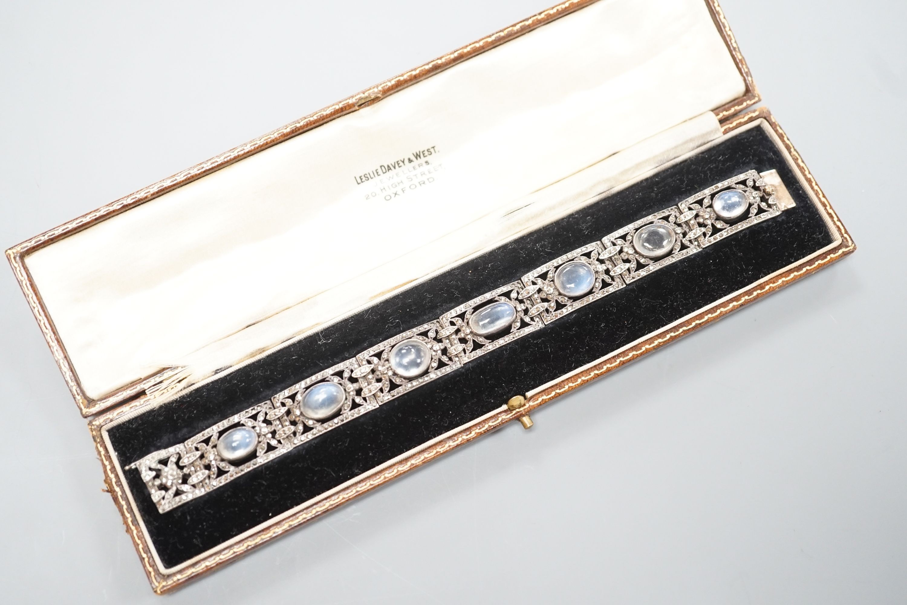 An early 20th century white metal, nine stone cabochon moonstone and marcasite set bracelet, 17.2cm.